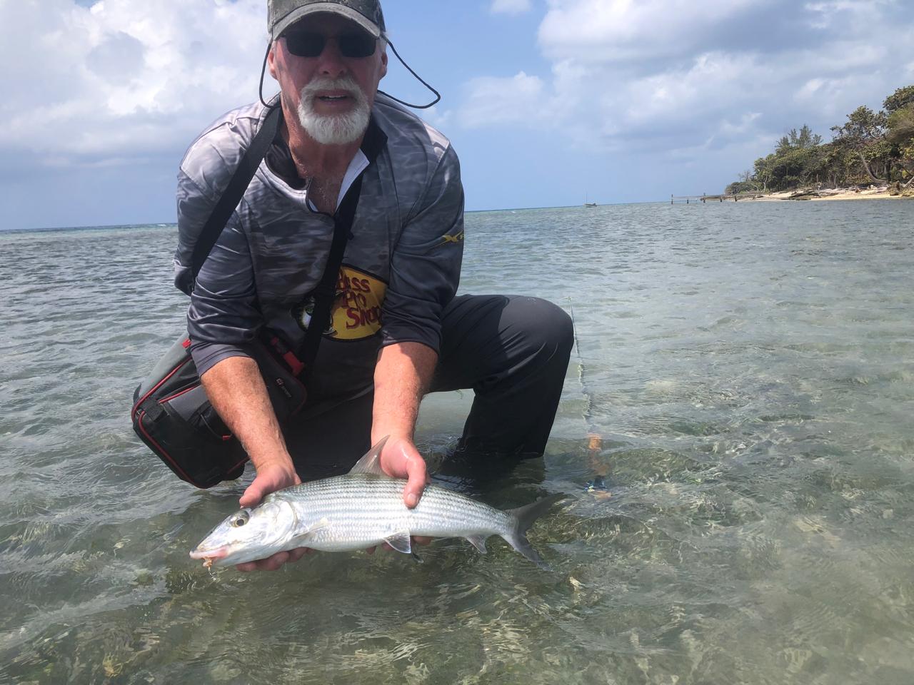 Roatan fishing guest with catch on the flats